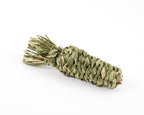 Dried timothy grass chew toy in shape of a carrot, photographed on a clean white background