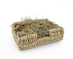 woven rectangular bunny bed made from select thatch filled with hay