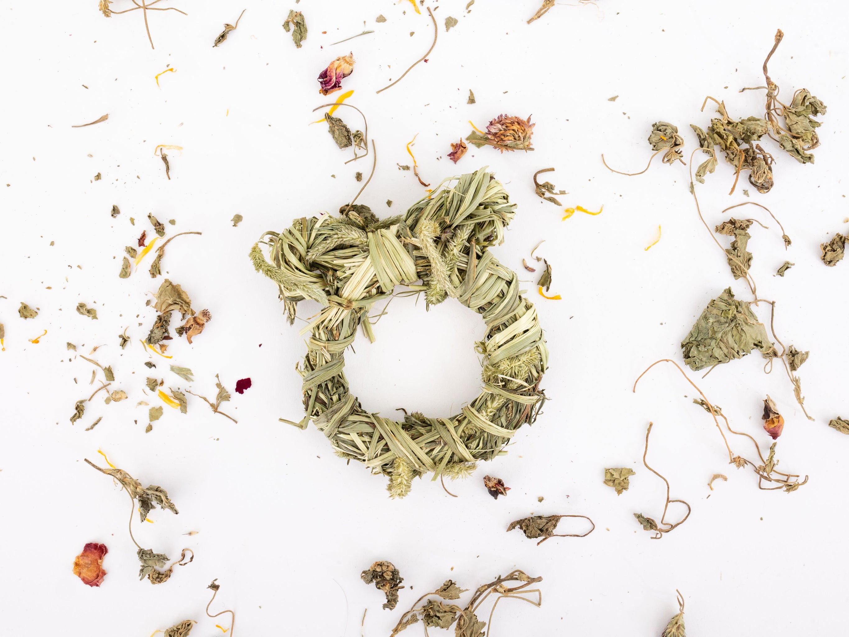 One hay wreaths on a scattered herb background