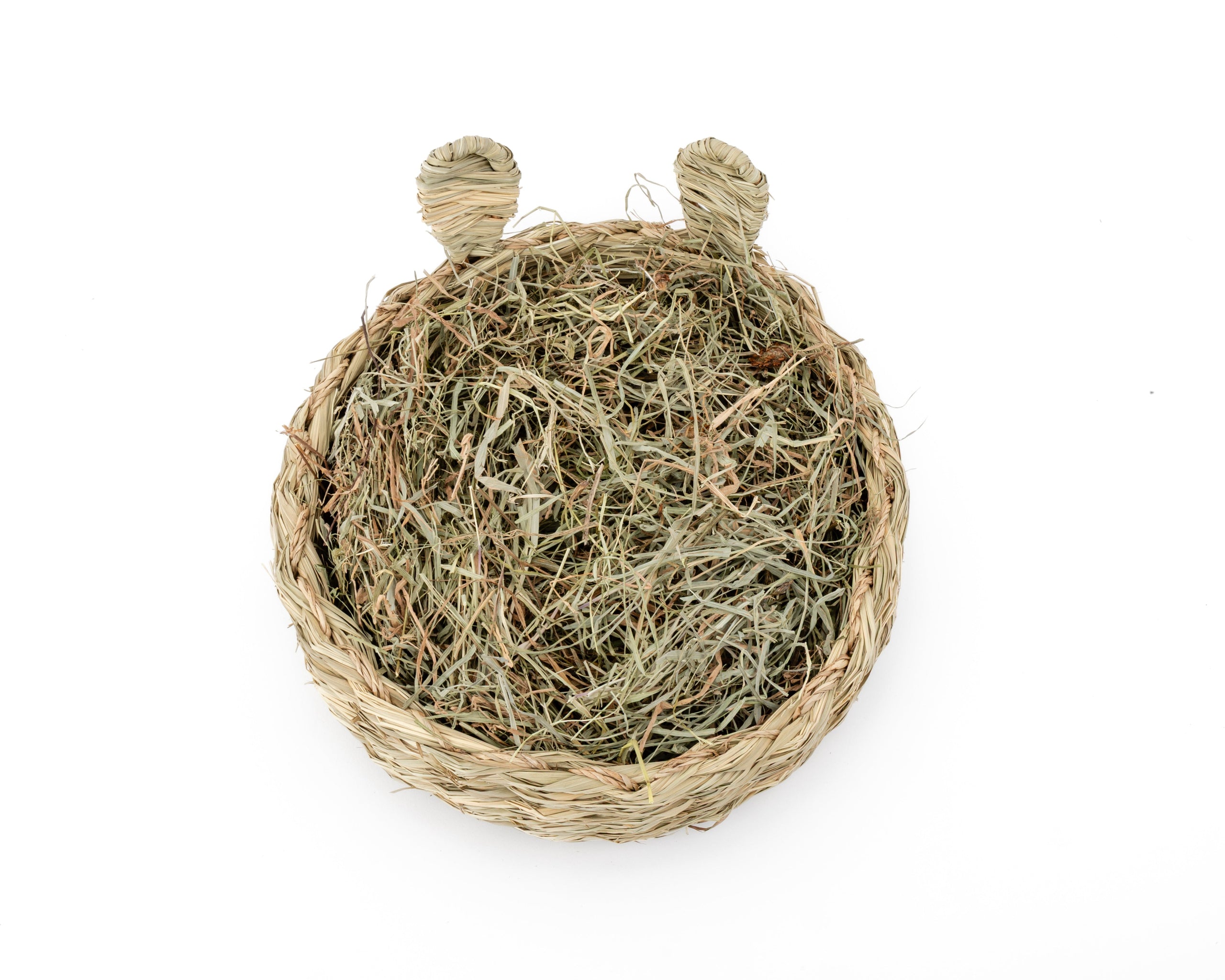 large hand woven basket made from select thatch, it has bunny ears and is filled with hay