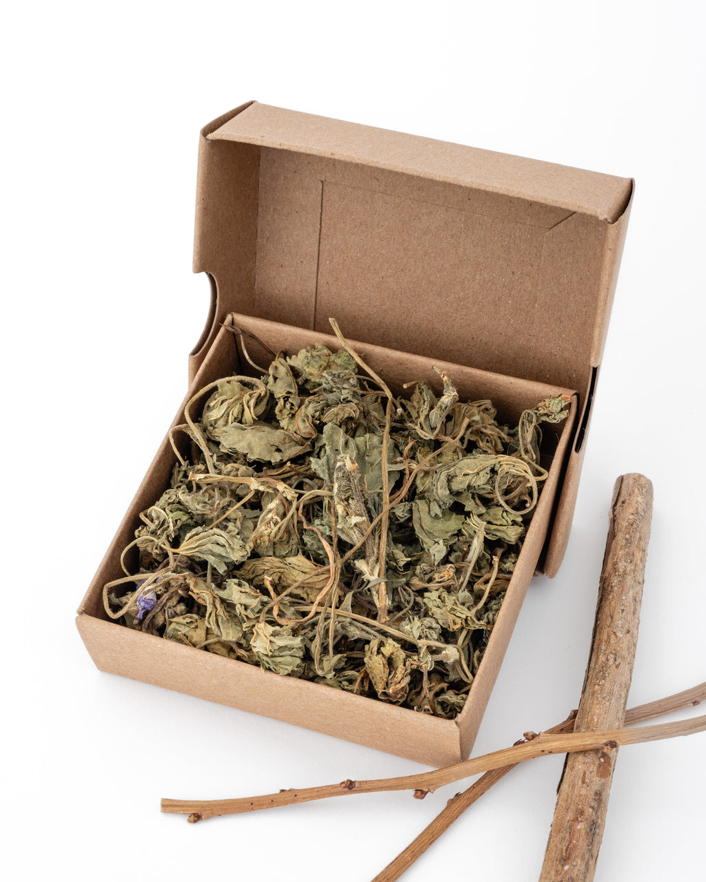 box of dried marshmallow leaves with blueberry sticks as decoration on the side