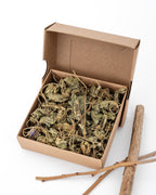 box of dried marshmallow leaves with blueberry sticks as decoration on the side